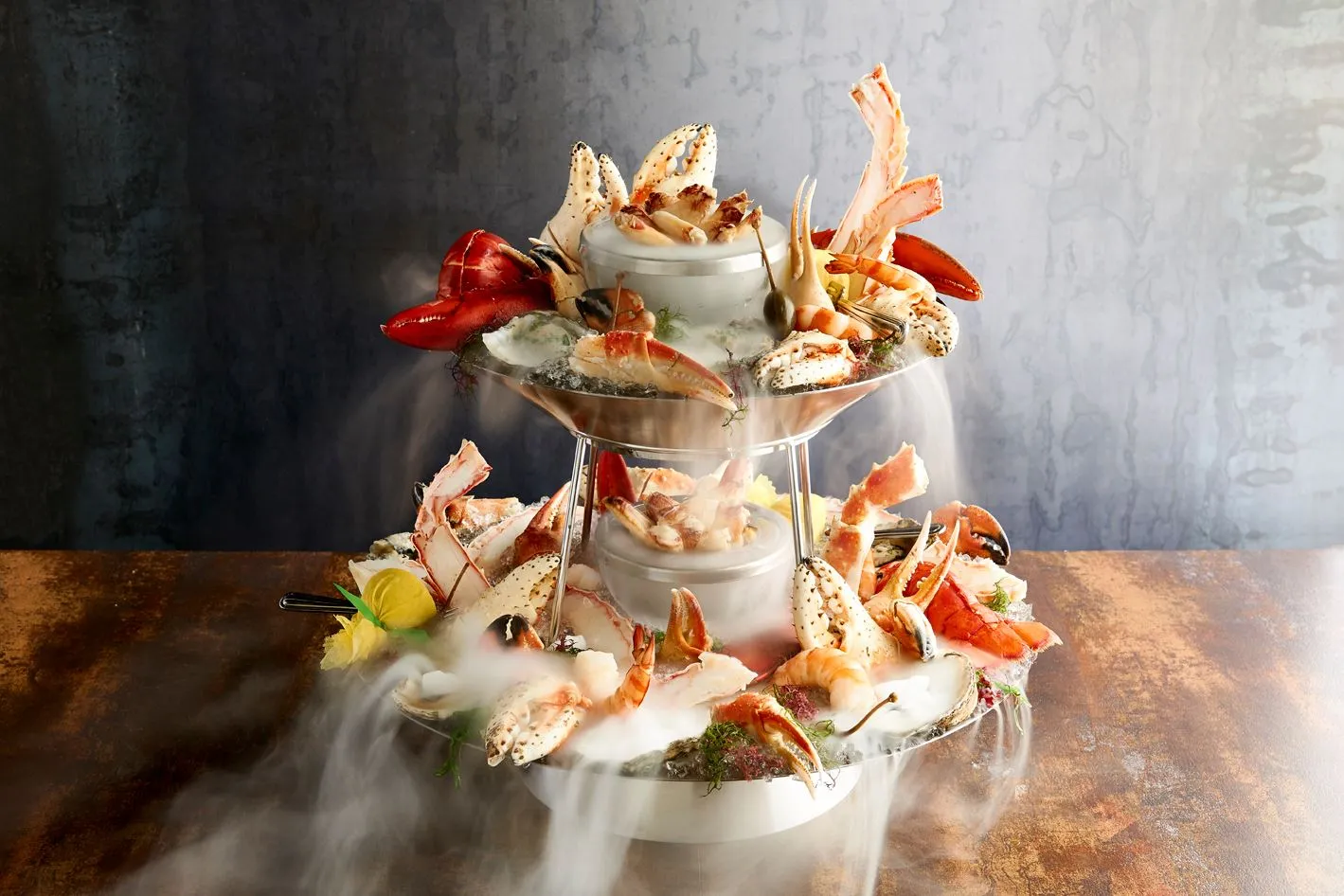 Mare signature dishes Grilled Whole Fish (Branzino, Orata), Mare's Famous Lobster Ravioli, Seafood Tower, Scallop and Truffle Risotto